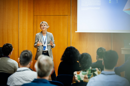 Woman talking to a room full of people
